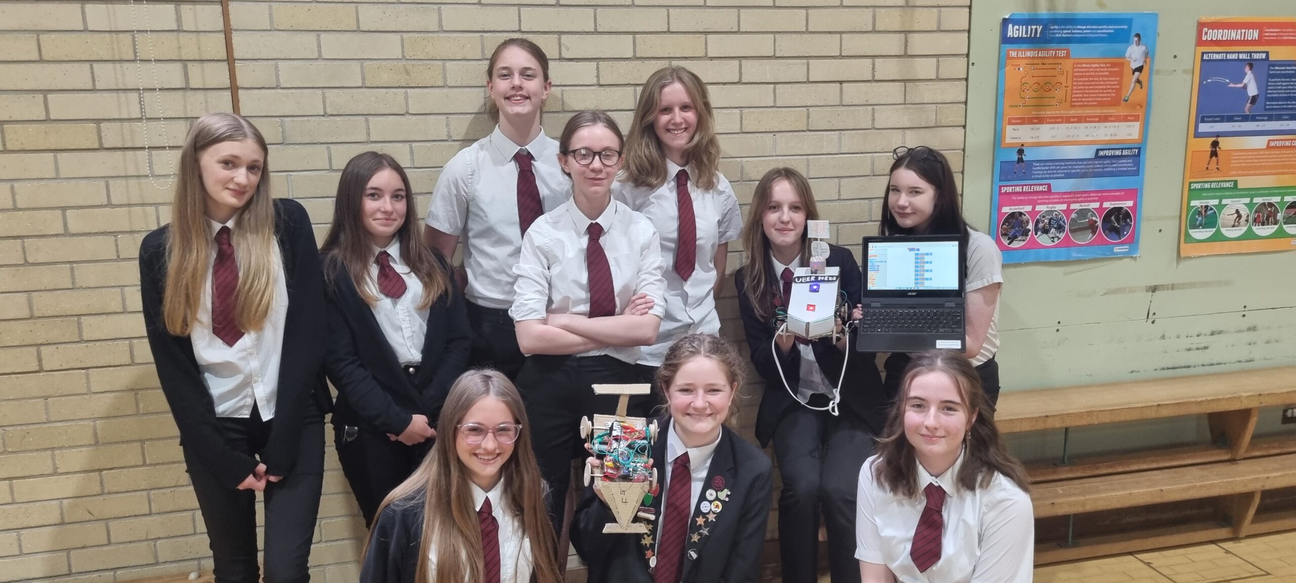 Tiverton High School students at a STEM event with their final piece